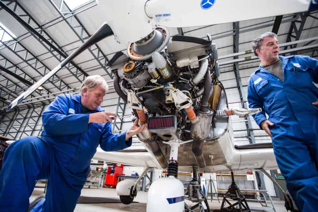 Babcock technicians maintaining a Grob aircraft at RAF Barkston Heath