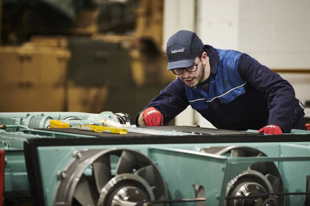 Babcock vehicle technician working on military vehicle