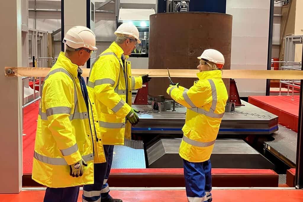 Dame Ruth Cairnie DBE with CNC machine at Babcock Rosyth